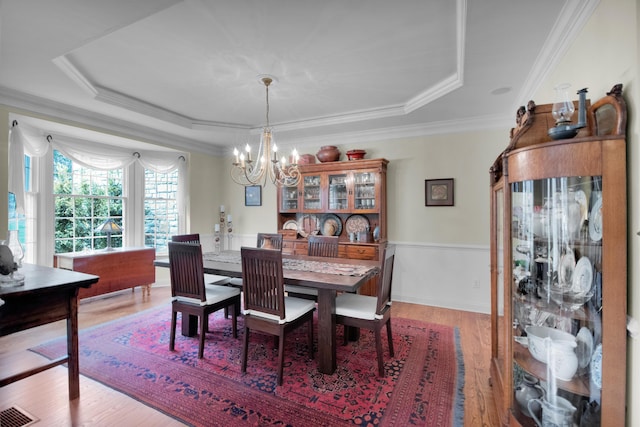 117 Morning Side Ter, East Stroudsburg, PA 18302 - dining room featuring a tray ceiling, visible vents, light wood-style floors, crown molding, and a notable chandelier