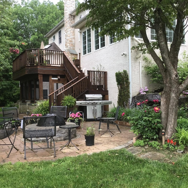 117 Morning Side Ter, East Stroudsburg, PA 18302 - rear view of house featuring a wooden deck, stairs, a patio, and an outdoor fire pit