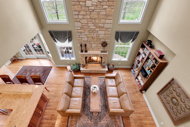 117 Morning Side Ter, East Stroudsburg, PA 18302 - living area with wood finished floors, a high ceiling, and baseboards