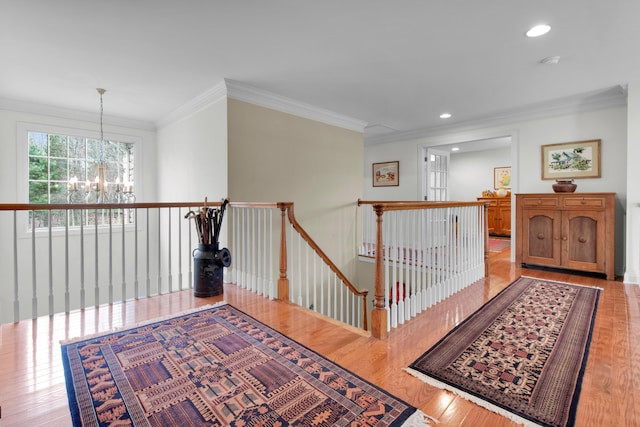 117 Morning Side Ter, East Stroudsburg, PA 18302 - hall featuring a notable chandelier, wood finished floors, an upstairs landing, and crown molding