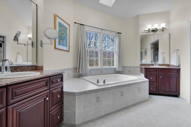 117 Morning Side Ter, East Stroudsburg, PA 18302 - bathroom featuring a skylight, tile patterned floors, a garden tub, and a sink