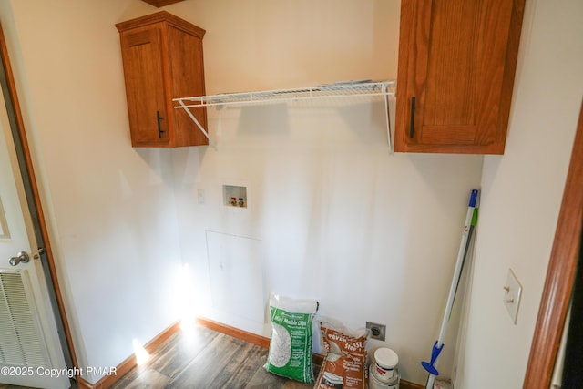 laundry area featuring cabinet space, hookup for a washing machine, hookup for an electric dryer, and wood finished floors