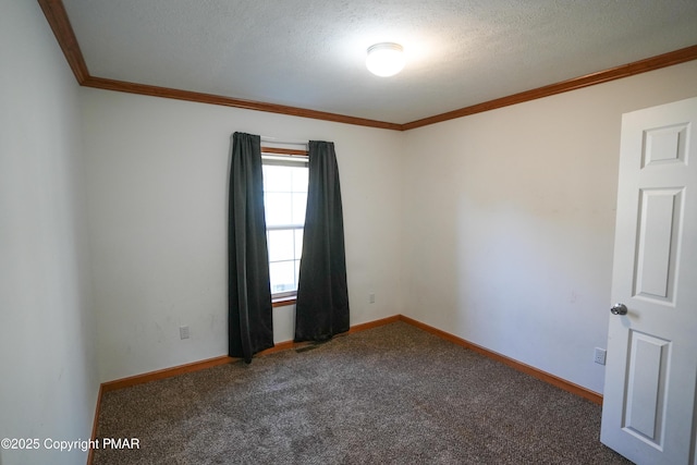 carpeted spare room with a textured ceiling, crown molding, and baseboards