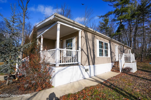 view of front of home featuring crawl space and covered porch