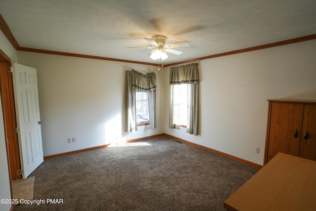 unfurnished bedroom featuring visible vents, baseboards, ornamental molding, carpet floors, and a textured ceiling