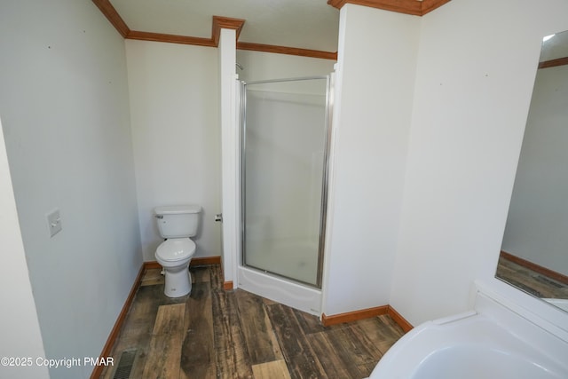 full bath with visible vents, toilet, wood finished floors, a shower stall, and baseboards