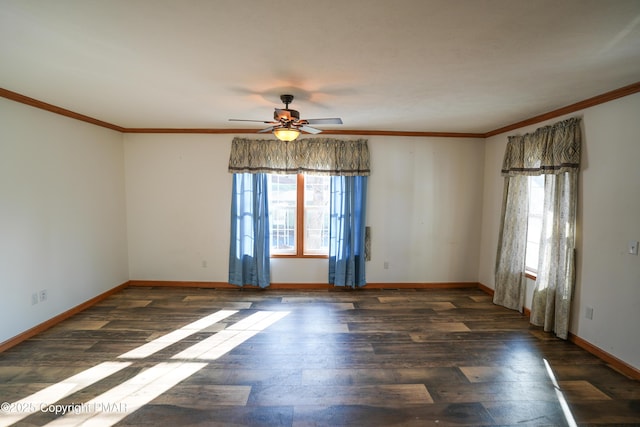 spare room with plenty of natural light, wood finished floors, and crown molding