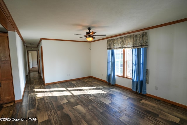 spare room with baseboards, wood finished floors, and ornamental molding