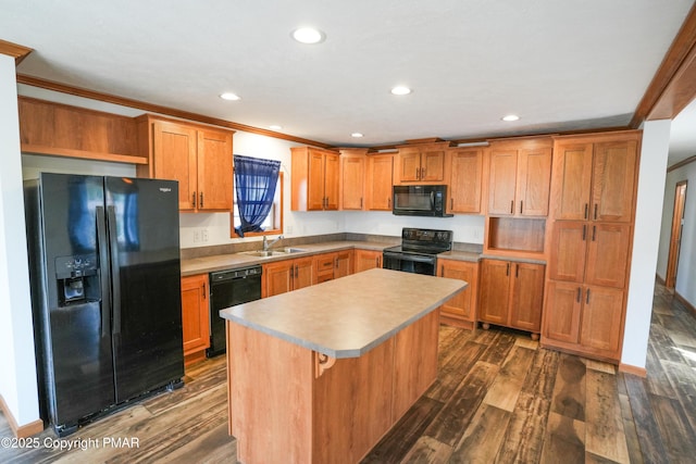 kitchen featuring a kitchen island, black appliances, ornamental molding, and dark wood-style flooring