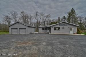 view of front of home featuring an outbuilding