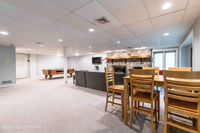 carpeted dining space featuring visible vents, recessed lighting, pool table, and a stone fireplace