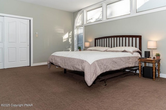 carpeted bedroom featuring baseboards