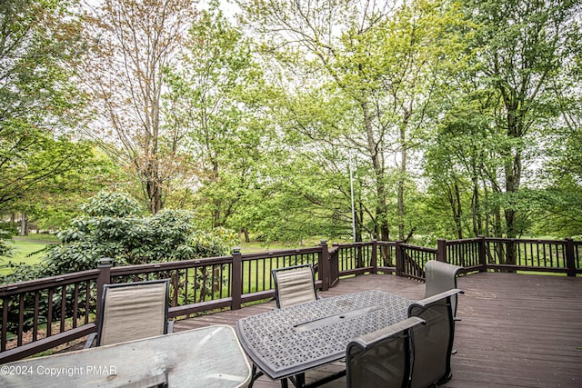 wooden deck with outdoor dining space