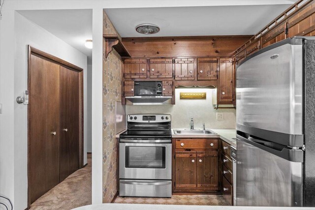 1371 Brian Ln, Effort, PA 18330 - kitchen featuring appliances with stainless steel finishes, extractor fan, and light countertops