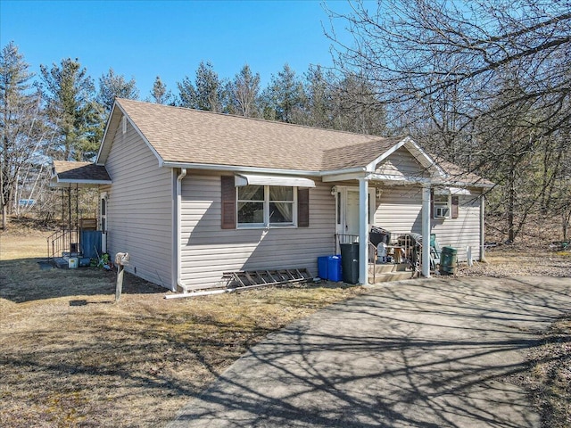 view of front of home featuring roof with shingles