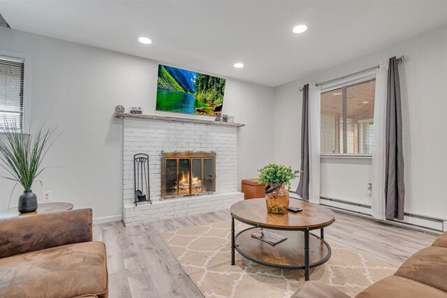 3509 Peak Dr, Tobyhanna, PA 18466 - living area featuring a brick fireplace, a baseboard radiator, baseboards, wood finished floors, and recessed lighting