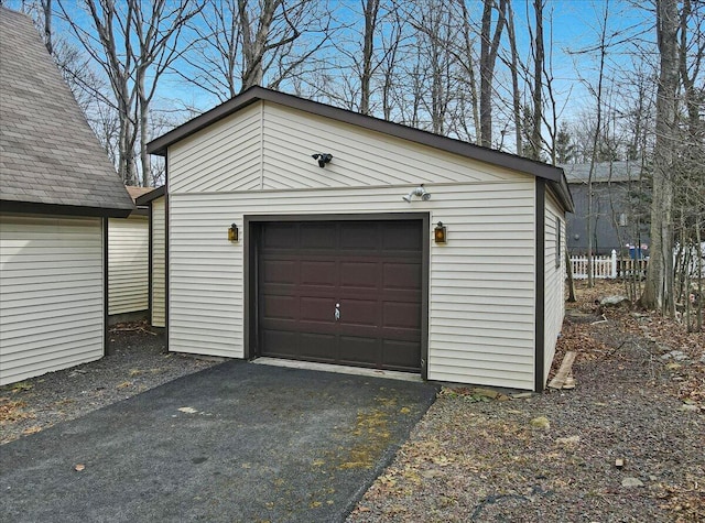 detached garage featuring driveway