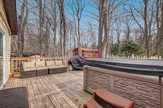 wooden terrace with an outdoor hangout area and a hot tub