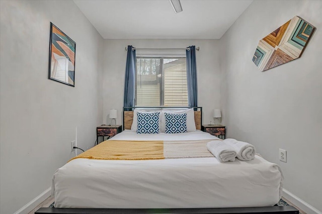 bedroom featuring baseboards