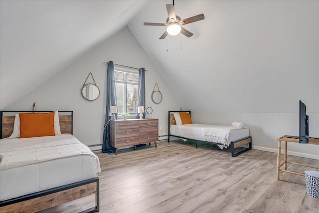 bedroom with wood finished floors, baseboards, ceiling fan, vaulted ceiling, and a baseboard heating unit