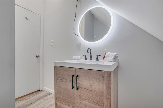 bathroom featuring vanity and wood finished floors