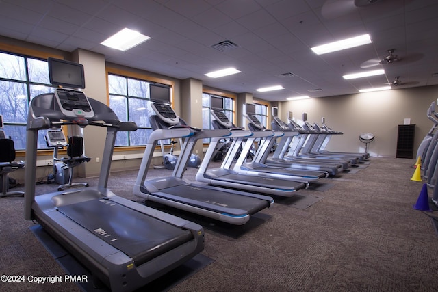 workout area featuring a drop ceiling