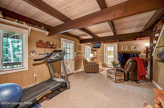 workout area with washer / clothes dryer, wood ceiling, and light colored carpet