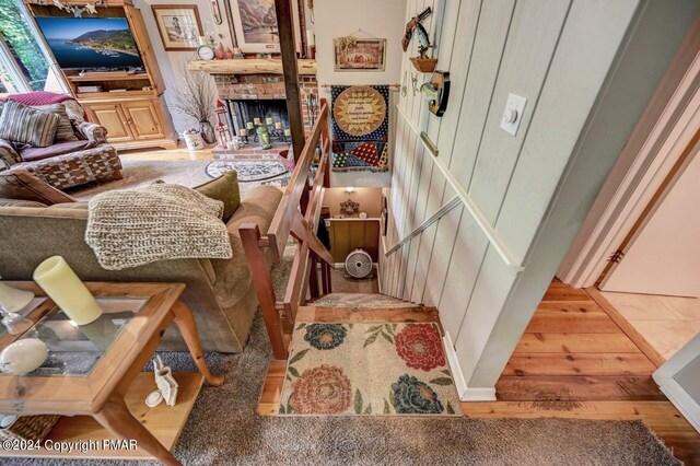 interior space with hardwood / wood-style flooring and a fireplace