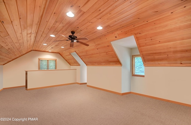 additional living space featuring ceiling fan, lofted ceiling, wooden ceiling, and carpet