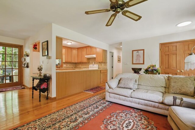 5153 Cresco Dr, Pocono Lake, PA 18347 - living area with light wood-style flooring and a ceiling fan