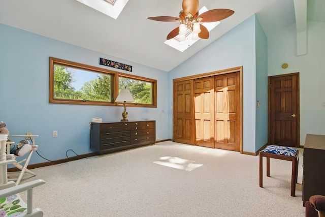 5153 Cresco Dr, Pocono Lake, PA 18347 - sitting room featuring a skylight, ceiling fan, carpet flooring, baseboards, and high vaulted ceiling
