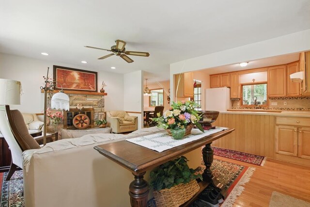 5153 Cresco Dr, Pocono Lake, PA 18347 - living area featuring ceiling fan, light wood-type flooring, a stone fireplace, and recessed lighting