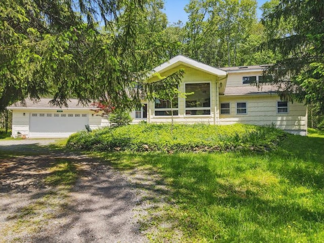 5153 Cresco Dr, Pocono Lake, PA 18347 - view of front of house with dirt driveway and an attached garage