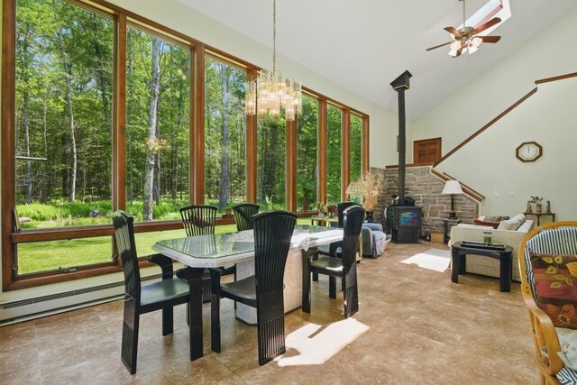 5153 Cresco Dr, Pocono Lake, PA 18347 - sunroom with a wood stove, lofted ceiling, and a chandelier