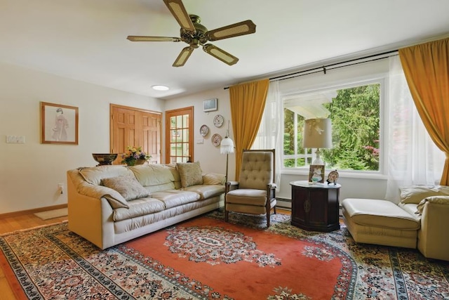 5153 Cresco Dr, Pocono Lake, PA 18347 - living area featuring a ceiling fan, wood finished floors, a baseboard radiator, and baseboards