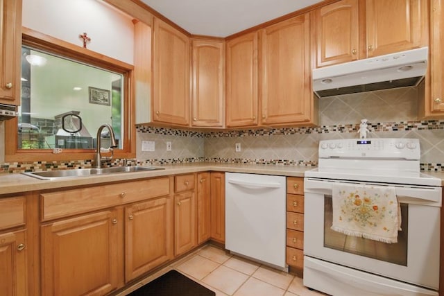 5153 Cresco Dr, Pocono Lake, PA 18347 - kitchen with white appliances, under cabinet range hood, a sink, decorative backsplash, and light countertops