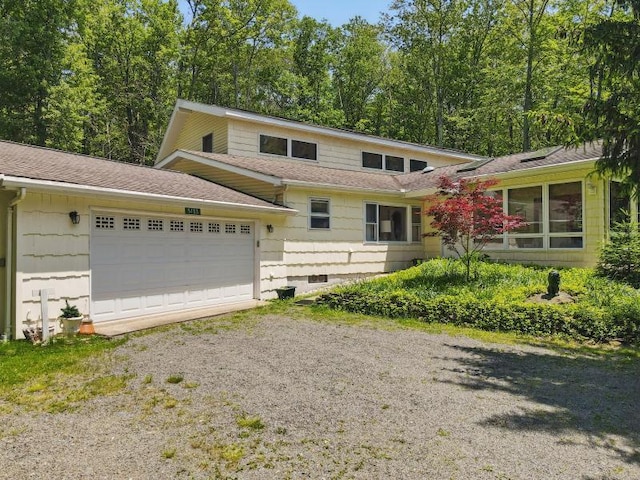 5153 Cresco Dr, Pocono Lake, PA 18347 - split level home featuring dirt driveway, an attached garage, and roof with shingles