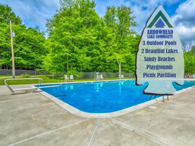 5153 Cresco Dr, Pocono Lake, PA 18347 - community pool featuring a patio area