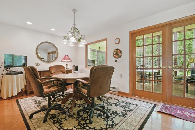 5153 Cresco Dr, Pocono Lake, PA 18347 - dining area with a chandelier, wood finished floors, recessed lighting, and a baseboard radiator