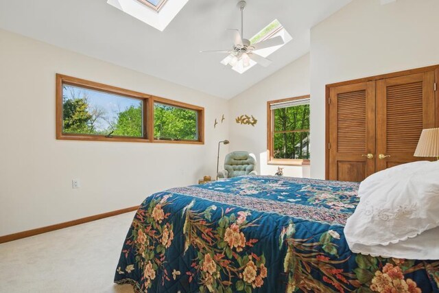 5153 Cresco Dr, Pocono Lake, PA 18347 - carpeted bedroom with a skylight, multiple windows, vaulted ceiling, and baseboards