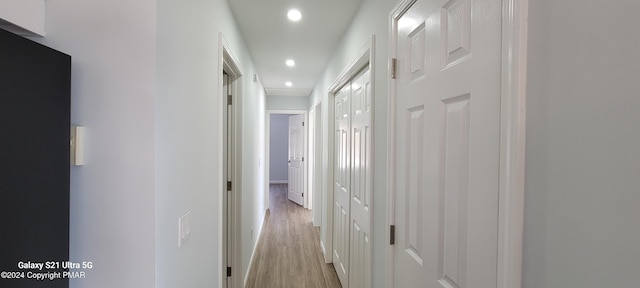 hallway featuring recessed lighting and light wood-style flooring