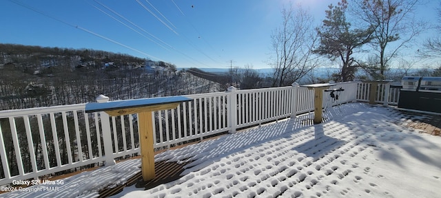 view of snow covered deck