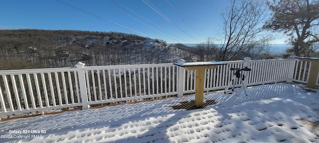 view of snow covered deck