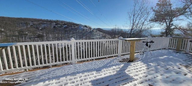 view of snow covered deck