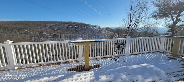 view of snow covered deck