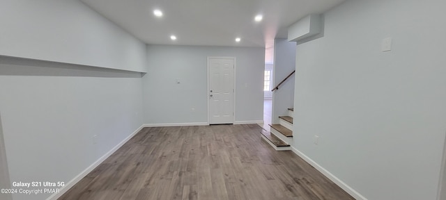 entrance foyer featuring recessed lighting, wood finished floors, baseboards, and stairs