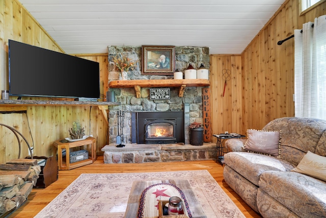 354 Fawn Rd, Pocono Lake, PA 18347 - living room with wooden walls, a fireplace, wood finished floors, healthy amount of natural light, and lofted ceiling
