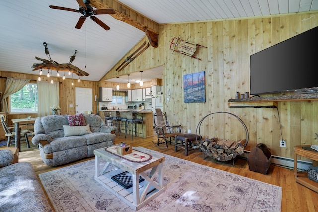 354 Fawn Rd, Pocono Lake, PA 18347 - living room featuring wooden walls, a ceiling fan, and light wood-style flooring