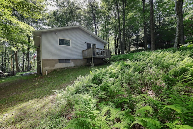 354 Fawn Rd, Pocono Lake, PA 18347 - view of property exterior with a deck and view of wooded area