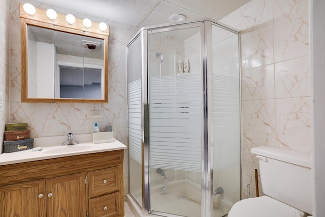 354 Fawn Rd, Pocono Lake, PA 18347 - bathroom with tile walls, vanity, a stall shower, and backsplash